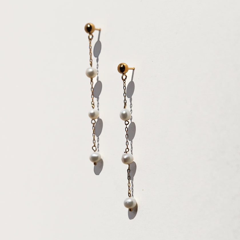Triple floating tiny pearl earrings.