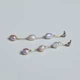 Long triple baroque pearl earrings with diamond stud