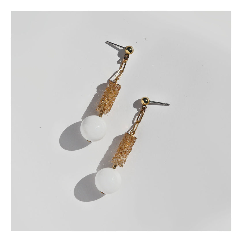 Champagne crystal column earrings with white orb.