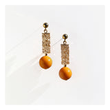 Champagne crystal tube and orange ball drop earrings.