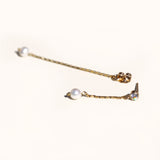 Delicate double chain pearl drop earrings.