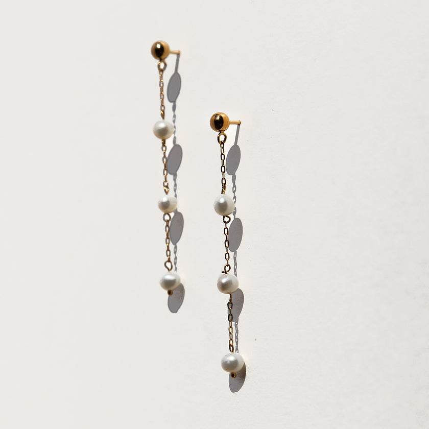 Triple floating tiny pearl earrings.