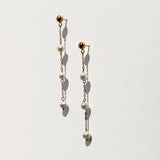 Triple floating tiny pearl earrings.