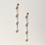 Triple floating tiny pearl earrings.