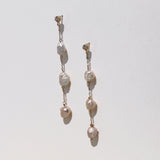 Long triple baroque pearl earrings with diamond stud