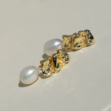 Gold crushed metal stud and pearl drop earring.