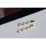 Gold nugget stud triple baroque pearl earrings.