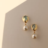 Gold nugget pearl drop earrings.