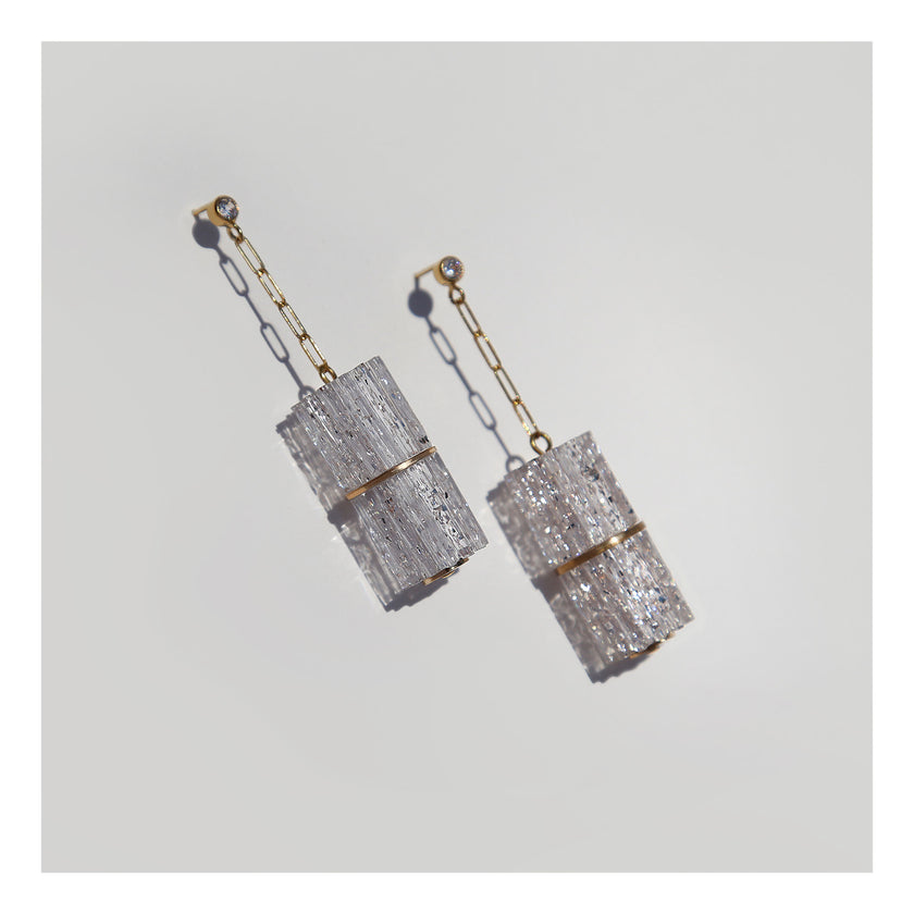 Futuristic paperclip chain and lucite column dangle earrings.