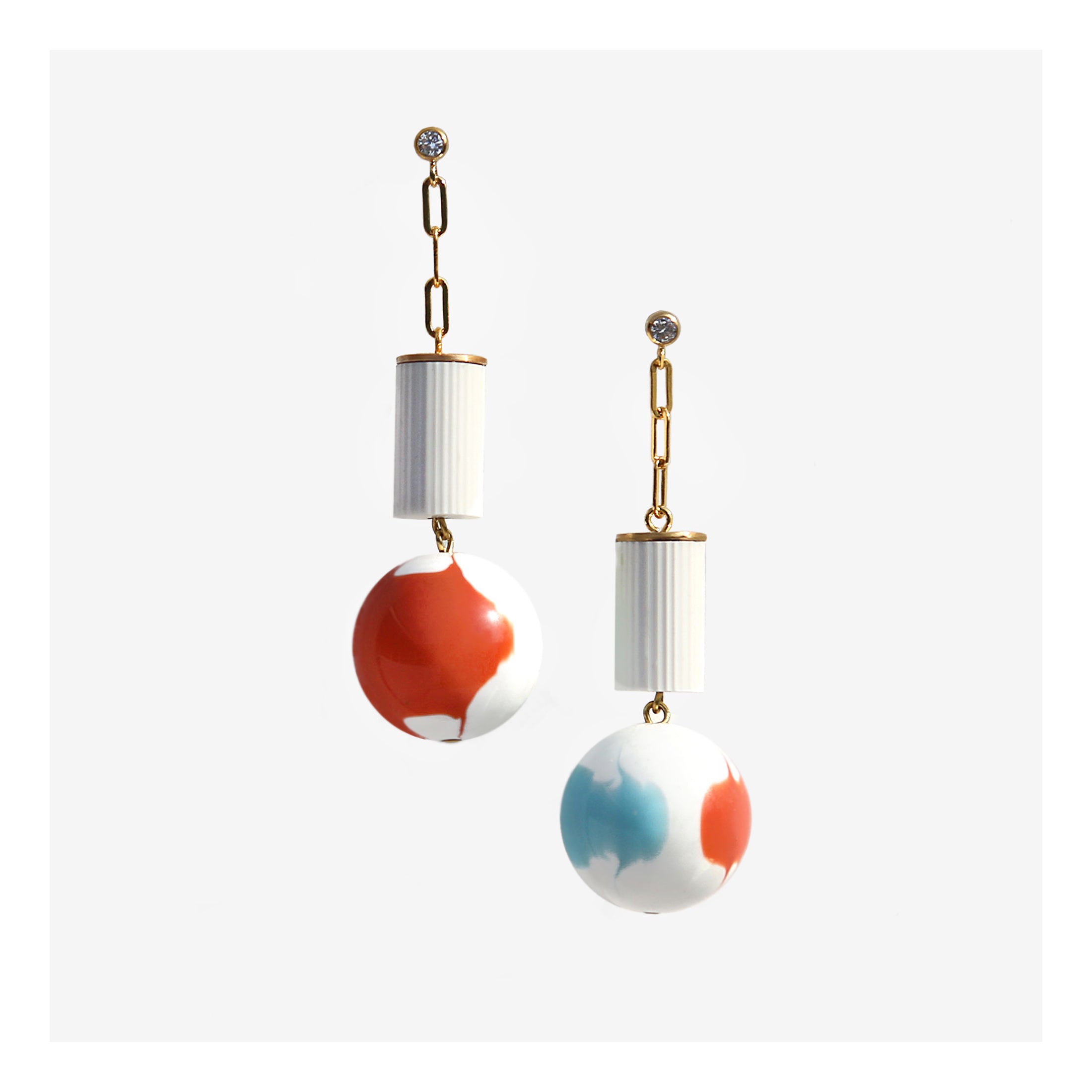 White column and marbled orb drop earrings.