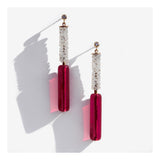 Long pink lucite earrings with crystal column.