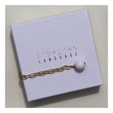 Gold paperclip chain & moonstone drop bracelet.